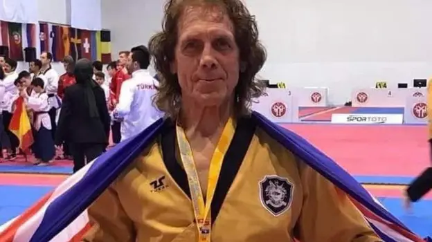 Former footballer represents country in Taekwondo